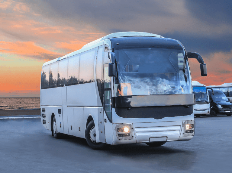 Coach-bus-parked-sunset-in-background