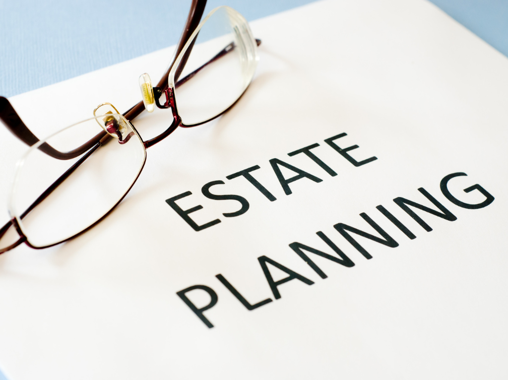 picture-of-title-estate-planning-with folded-glasses-on-top-of-document