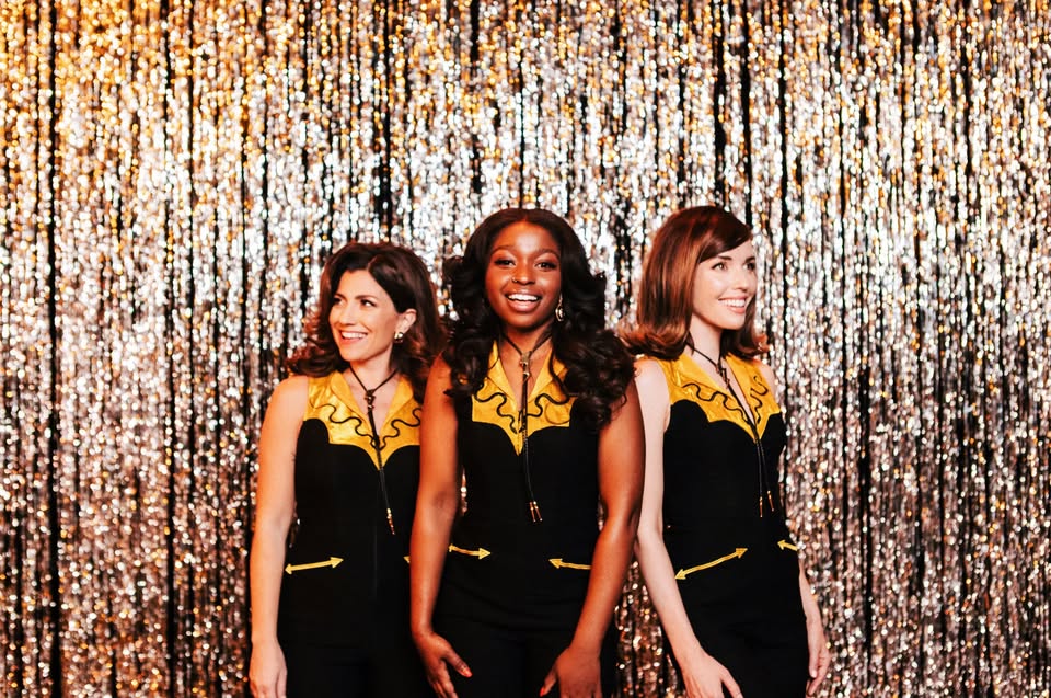 The Lovettes in black dresses